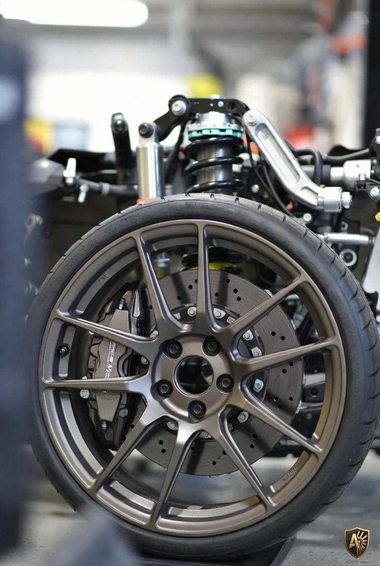 Solid billet of aluminum under extreme pressure during forged wheel production concept